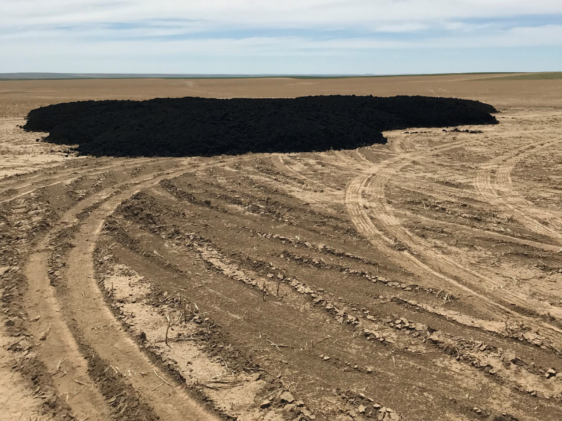 Biosolids delivered to a field to be spread over the land