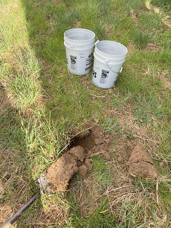 Soil sampling at the study site. Photo by Zachary Goldberg.
