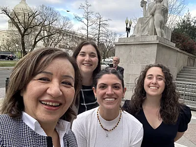 Four Society advocates pose on Capitol Hill