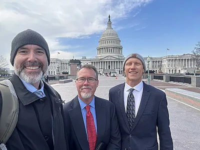 From l to r: Aaron Daigh, Kenneth Carroll, and Russell Lutter in front of the U.S. Capitol during Congressional Visits Day in February 2026. 