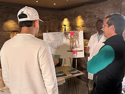 Figure 1. At the “Saturday With a Scientist” event in Salt Lake City, UT, SSSA K-12 Committee member Wale Adewunmi talks with visitors about the “Soil Your Undies” activity. Photo by Liz Gillispie.