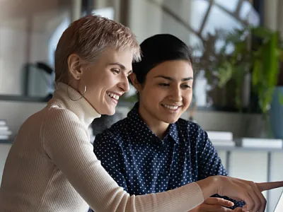 Two woman working together